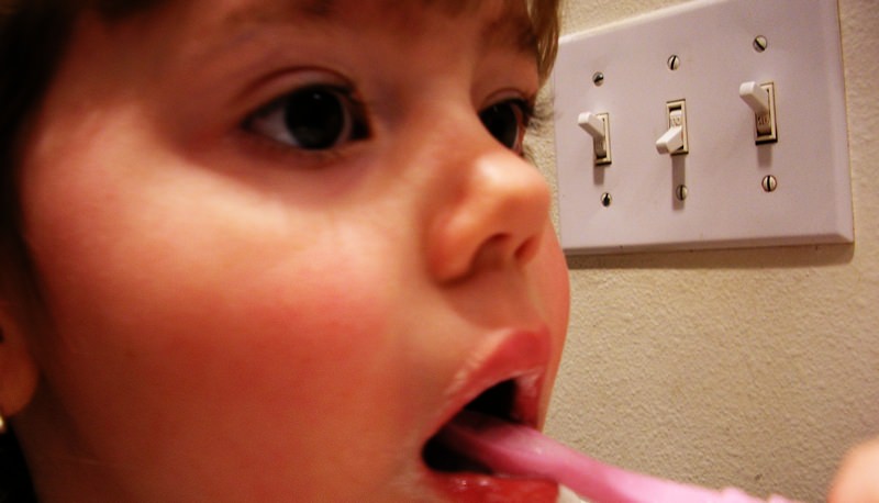 Child brushing teeth